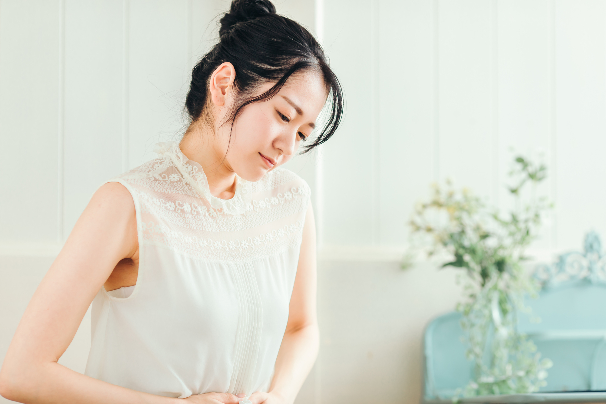 胸やけの症状にお困りの女性